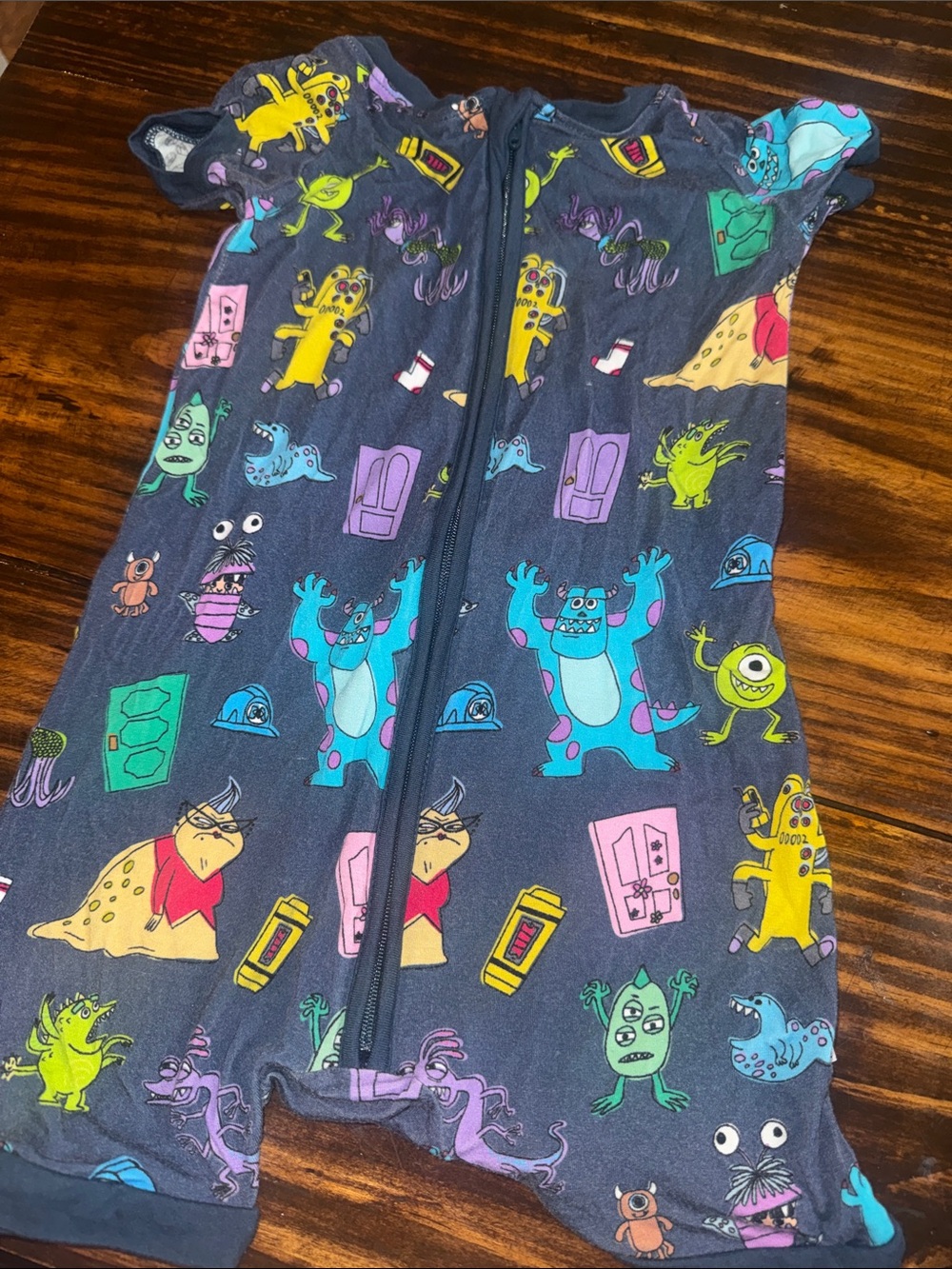 Little Sleepies navy blue monster print one-piece bodysuit
